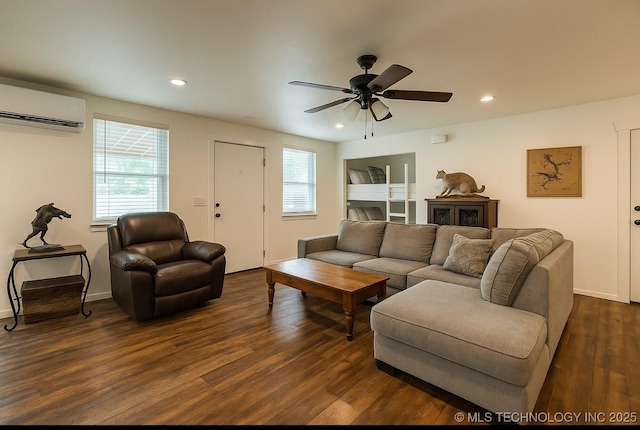 416602 E 1065, Checotah, OK 74426 - living room featuring a wall mounted air conditioner, dark wood-style flooring, ceiling fan, and recessed lighting