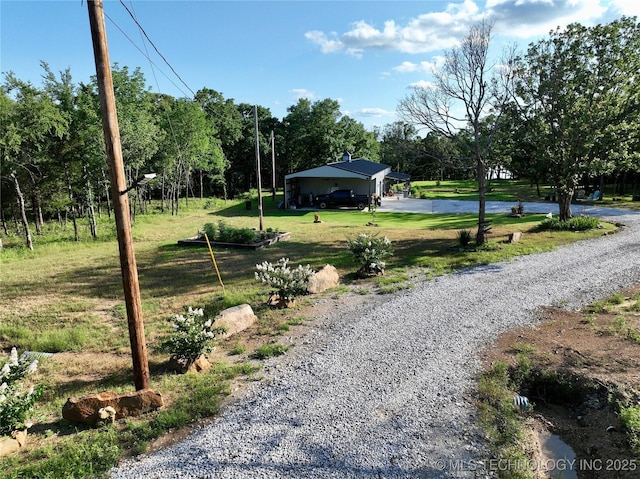 416602 E 1065, Checotah, OK 74426 - view of grassy yard featuring driveway