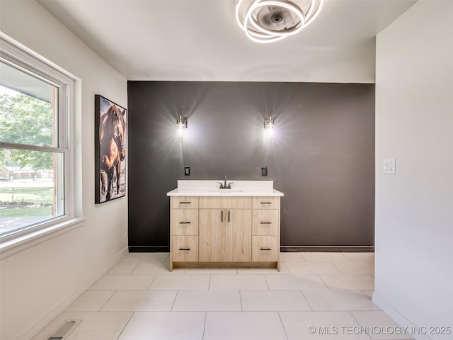 701 W 41st St, Sand Springs, OK 74063 - bathroom featuring vanity and tile patterned floors
