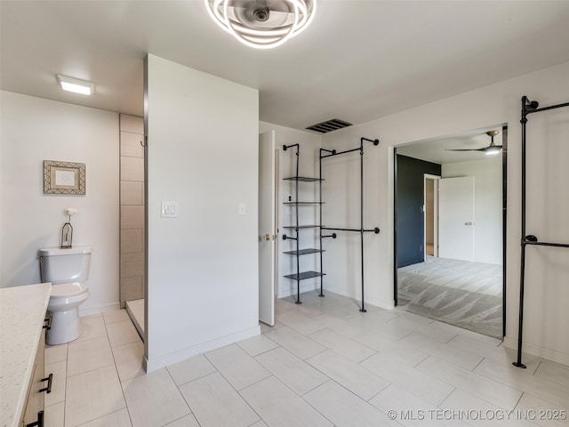 701 W 41st St, Sand Springs, OK 74063 - full bathroom with vanity, a ceiling fan, and tile patterned floors