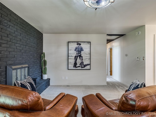 701 W 41st St, Sand Springs, OK 74063 - carpeted living area featuring a brick fireplace and baseboards