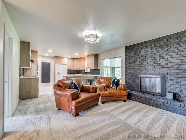 701 W 41st St, Sand Springs, OK 74063 - living room with light carpet and a brick fireplace