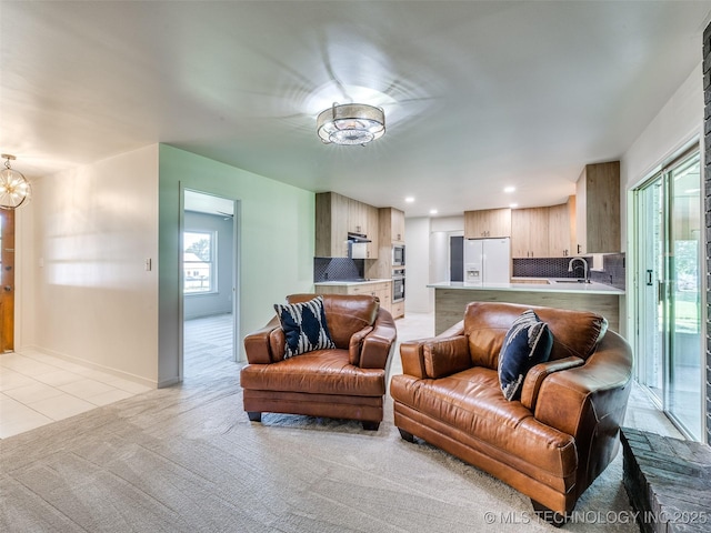 701 W 41st St, Sand Springs, OK 74063 - living room with a chandelier, light colored carpet, light tile patterned flooring, and recessed lighting