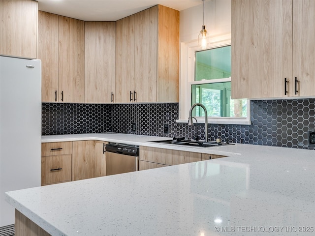 701 W 41st St, Sand Springs, OK 74063 - kitchen featuring light brown cabinetry, freestanding refrigerator, stainless steel dishwasher, and light stone counters