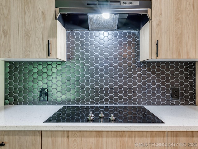 701 W 41st St, Sand Springs, OK 74063 - kitchen featuring light brown cabinets, extractor fan, decorative backsplash, and black electric stovetop