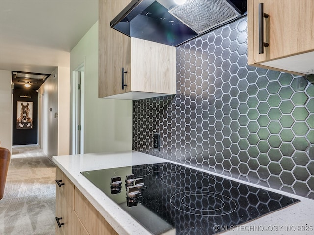 701 W 41st St, Sand Springs, OK 74063 - kitchen featuring light brown cabinetry, black electric stovetop, extractor fan, backsplash, and light stone countertops