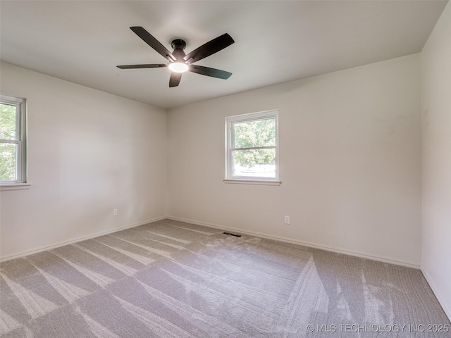 701 W 41st St, Sand Springs, OK 74063 - unfurnished room with carpet, healthy amount of natural light, and a ceiling fan