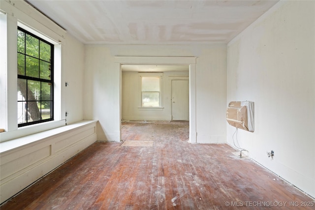1225 N C St, Muskogee, OK 74403 - spare room featuring wood-type flooring