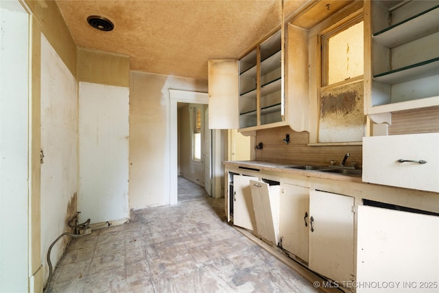 1225 N C St, Muskogee, OK 74403 - kitchen with open shelves, backsplash, and light countertops
