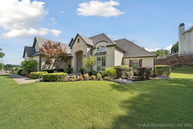 6140 E 140th St S, Bixby, OK 74008 - french provincial home featuring stone siding, roof with shingles, and brick siding