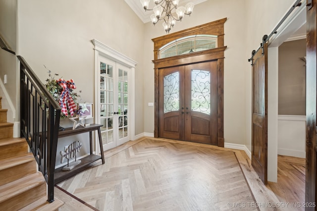 6140 E 140th St S, Bixby, OK 74008 - foyer with french doors, a barn door, stairs, a towering ceiling, and a chandelier