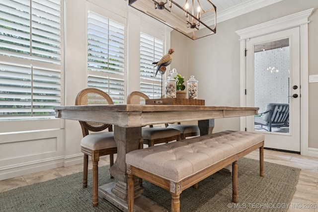 6140 E 140th St S, Bixby, OK 74008 - dining area featuring a chandelier, crown molding, and healthy amount of natural light