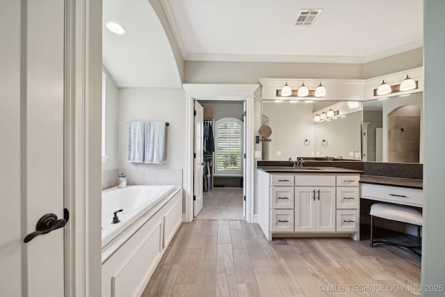 6140 E 140th St S, Bixby, OK 74008 - full bathroom featuring vanity, a bath, ornamental molding, and wood finished floors