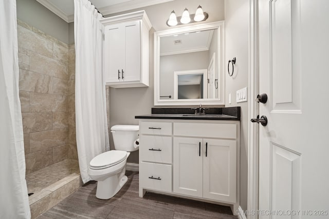 6140 E 140th St S, Bixby, OK 74008 - bathroom featuring ornamental molding, vanity, a tile shower, and wood finished floors
