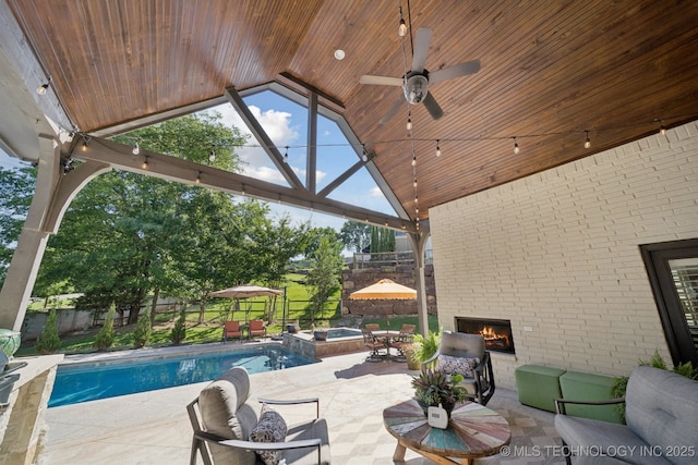 6140 E 140th St S, Bixby, OK 74008 - outdoor pool with a patio area, a fenced backyard, a ceiling fan, an in-ground hot tub, and an outdoor living space with a fireplace