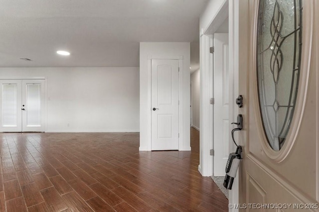 1706 S Madison Blvd, Bartlesville, OK 74006 - entryway featuring dark wood-style floors, recessed lighting, and french doors