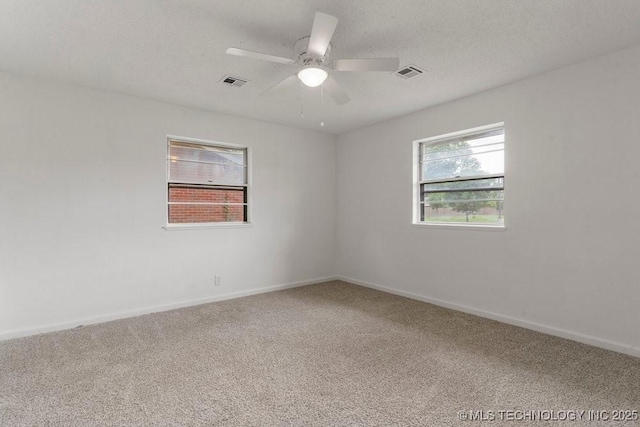 1706 S Madison Blvd, Bartlesville, OK 74006 - spare room with carpet and ceiling fan