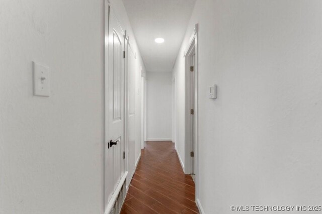 1706 S Madison Blvd, Bartlesville, OK 74006 - corridor featuring dark wood-style flooring and recessed lighting