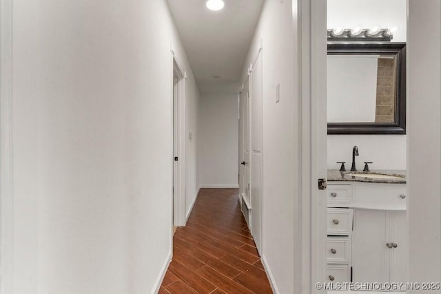 1706 S Madison Blvd, Bartlesville, OK 74006 - corridor with a sink and dark wood-type flooring