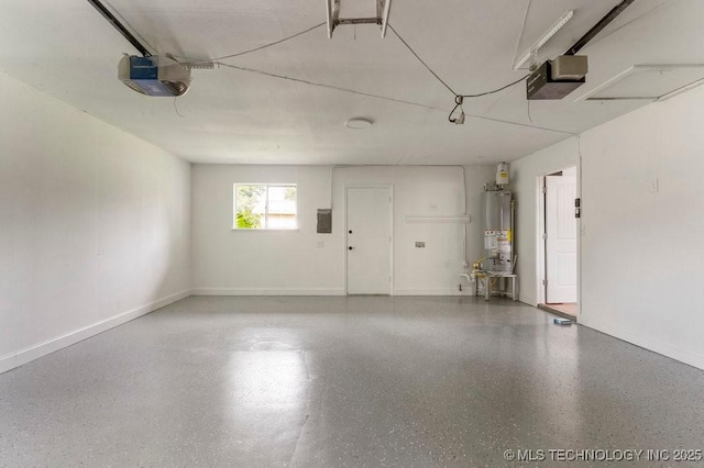 1706 S Madison Blvd, Bartlesville, OK 74006 - garage featuring gas water heater and a garage door opener