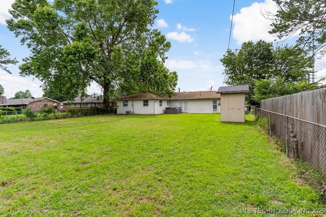 1706 S Madison Blvd, Bartlesville, OK 74006 - fenced backyard with a storage unit