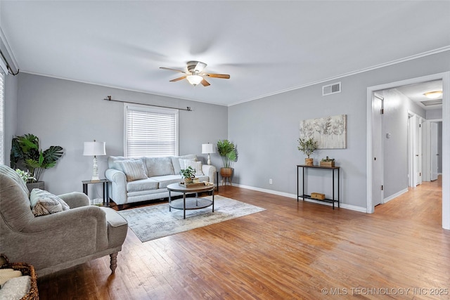 1809 Robison, Ardmore, OK 73401 - living area with ceiling fan, light wood-style flooring, and crown molding