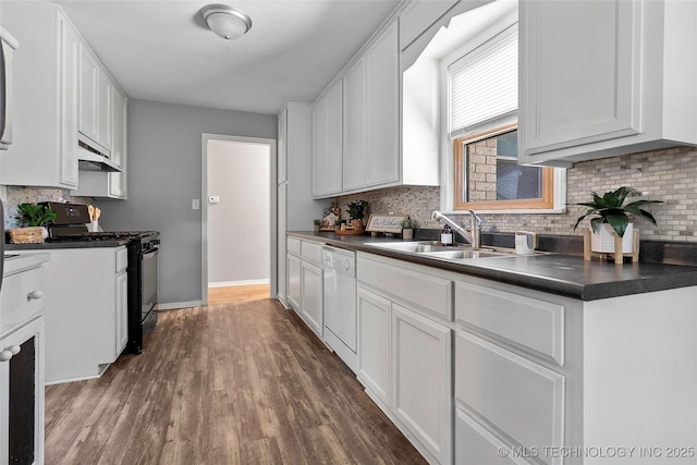 1809 Robison, Ardmore, OK 73401 - kitchen with black range with gas stovetop, dishwasher, ventilation hood, dark countertops, and tasteful backsplash