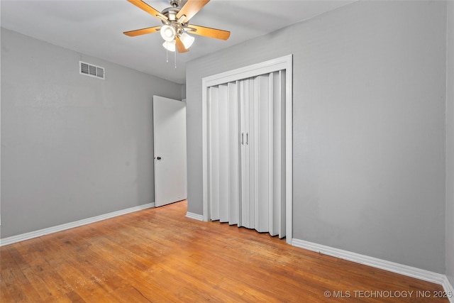 1809 Robison, Ardmore, OK 73401 - unfurnished bedroom featuring light wood-style flooring, a closet, and a ceiling fan