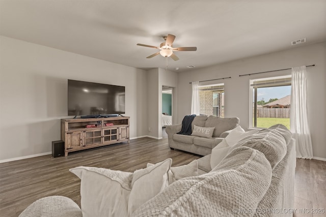13009 E 124th Ct, Collinsville, OK 74021 - living room featuring ceiling fan and dark wood-style flooring