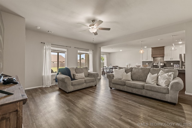 13009 E 124th Ct, Collinsville, OK 74021 - living room featuring ceiling fan and dark wood-type flooring