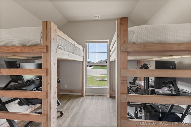 13009 E 124th Ct, Collinsville, OK 74021 - bedroom with a desk, wood finished floors, and lofted ceiling
