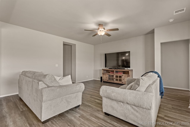 13009 E 124th Ct, Collinsville, OK 74021 - living room featuring a ceiling fan and dark wood-style floors