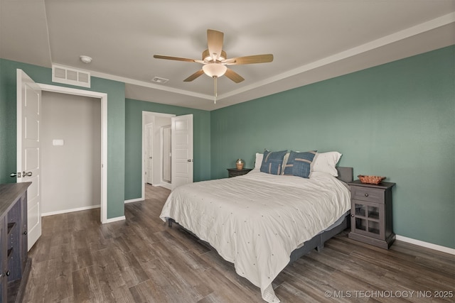 13009 E 124th Ct, Collinsville, OK 74021 - bedroom with dark wood-style flooring and a ceiling fan