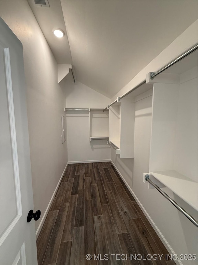 8940 E 161st Pl S, Bixby, OK 74008 - walk in closet with dark wood finished floors and vaulted ceiling