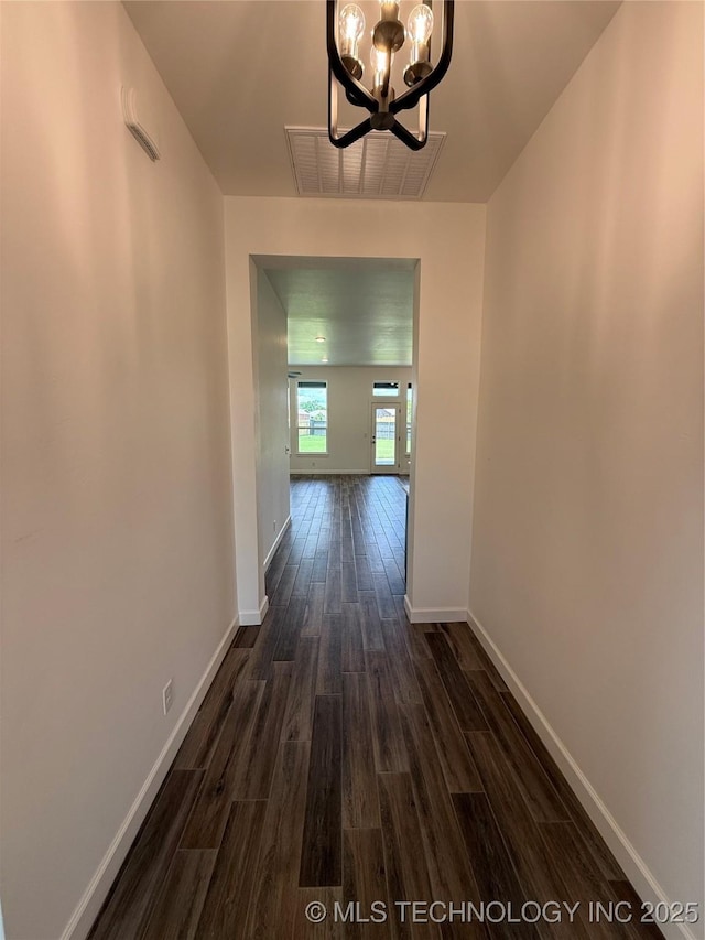 8940 E 161st Pl S, Bixby, OK 74008 - hallway featuring a chandelier and dark wood-style flooring
