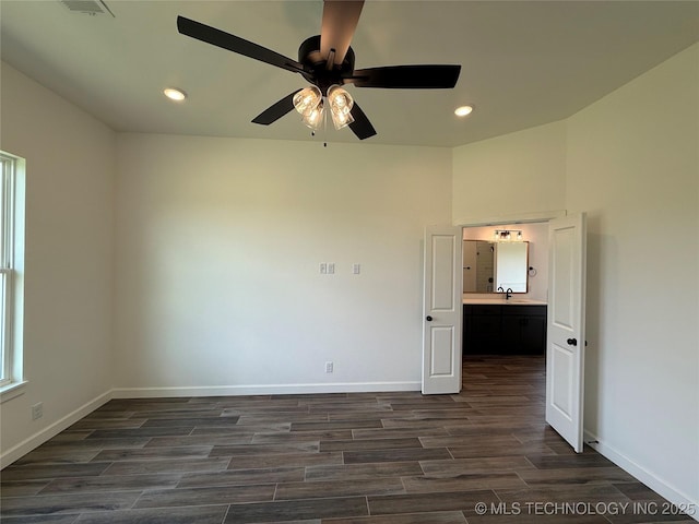 8940 E 161st Pl S, Bixby, OK 74008 - unfurnished room featuring dark wood-type flooring, ceiling fan, and recessed lighting