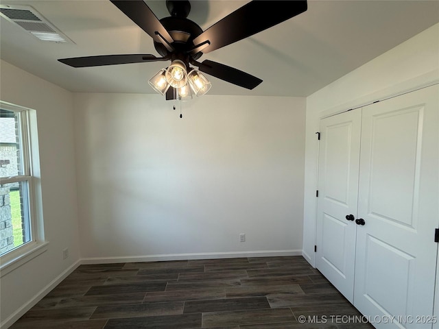 8940 E 161st Pl S, Bixby, OK 74008 - unfurnished room with plenty of natural light, dark wood finished floors, and ceiling fan