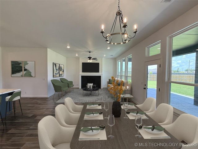 8940 E 161st Pl S, Bixby, OK 74008 - living room featuring dark wood finished floors, recessed lighting, a fireplace, ceiling fan, and a chandelier
