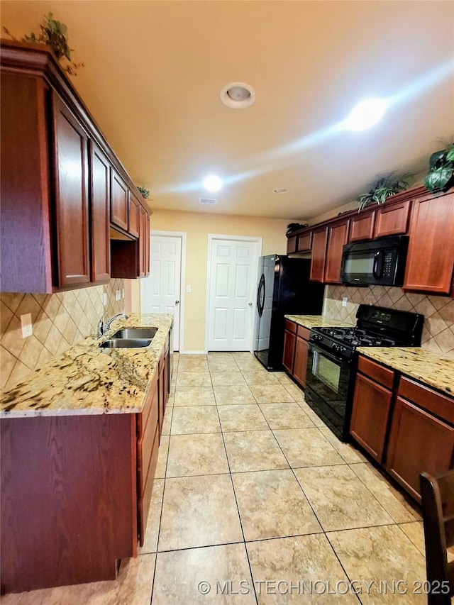 18328 E 42nd St, Tulsa, OK 74134 - kitchen with black appliances, backsplash, light tile patterned flooring, and light stone countertops