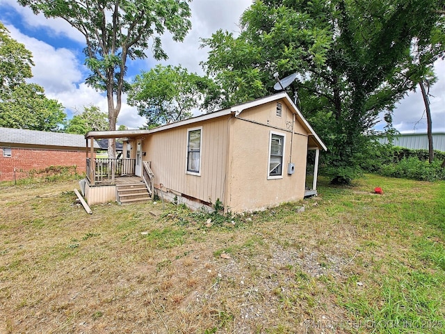 801 E Harrison St, Tahlequah, OK 74464 - view of front facade featuring a front lawn