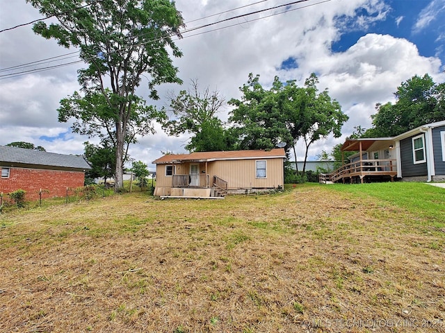 801 E Harrison St, Tahlequah, OK 74464 - view of green lawn featuring a wooden deck