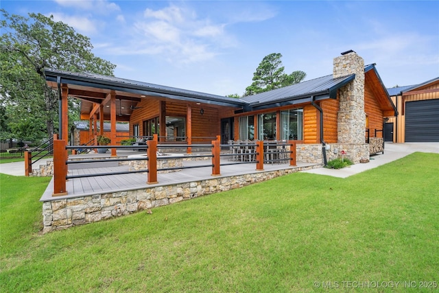 96164 S Strayhorn Heights Rd, Gore, OK 74435 - rear view of property featuring stone siding, faux log siding, a chimney, and a lawn