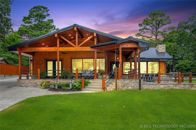96164 S Strayhorn Heights Rd, Gore, OK 74435 - view of front of property featuring covered porch, a chimney, a metal roof, and faux log siding