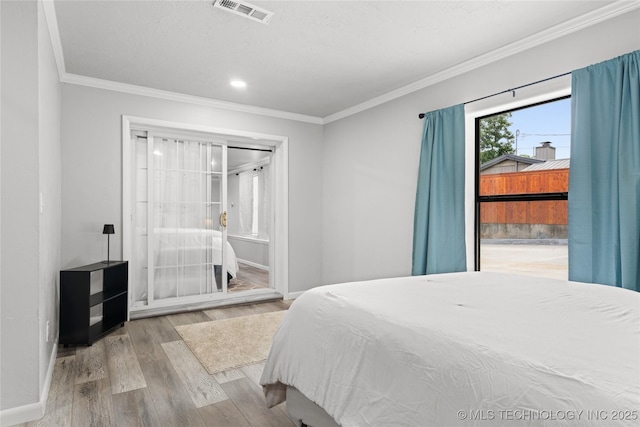 96164 S Strayhorn Heights Rd, Gore, OK 74435 - bedroom with crown molding, wood finished floors, and recessed lighting