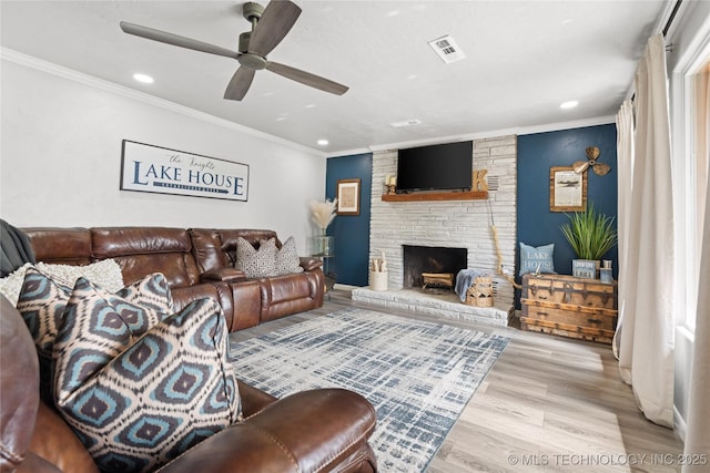 96164 S Strayhorn Heights Rd, Gore, OK 74435 - living room featuring a ceiling fan, recessed lighting, wood finished floors, ornamental molding, and a large fireplace