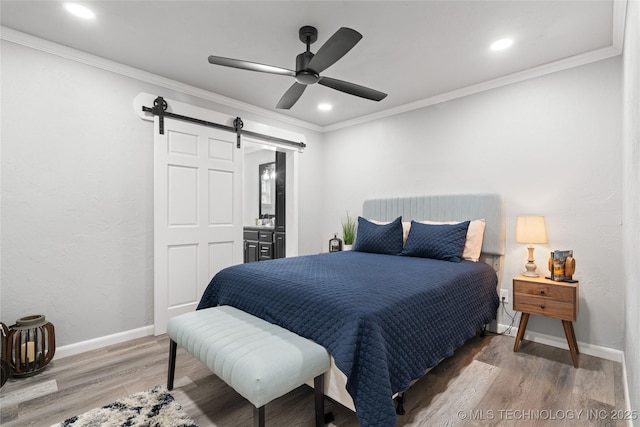 96164 S Strayhorn Heights Rd, Gore, OK 74435 - bedroom featuring a barn door, wood finished floors, crown molding, ceiling fan, and recessed lighting