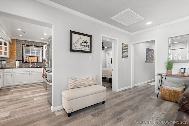 96164 S Strayhorn Heights Rd, Gore, OK 74435 - living area with crown molding, light wood-style floors, and recessed lighting