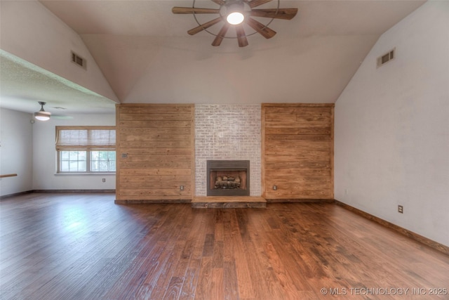 17542 W 1st St S, Sand Springs, OK 74063 - unfurnished living room with ceiling fan, vaulted ceiling, a fireplace, and wood finished floors