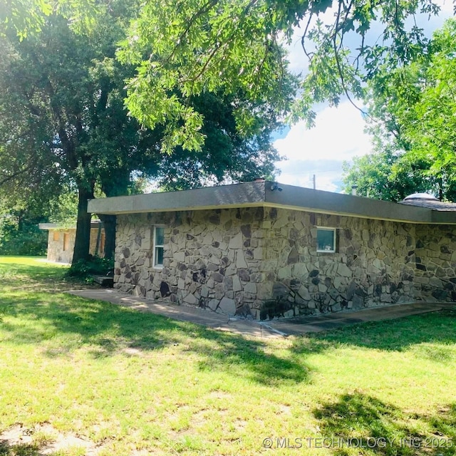 3622 S 82nd E Ave, Tulsa, OK 74145 - view of property exterior featuring stone siding and a yard