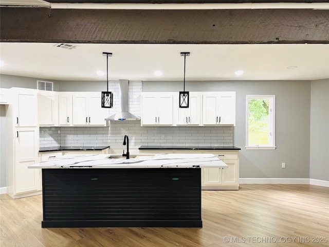 3622 S 82nd E Ave, Tulsa, OK 74145 - kitchen with wall chimney range hood, light wood-style floors, backsplash, white cabinetry, and recessed lighting
